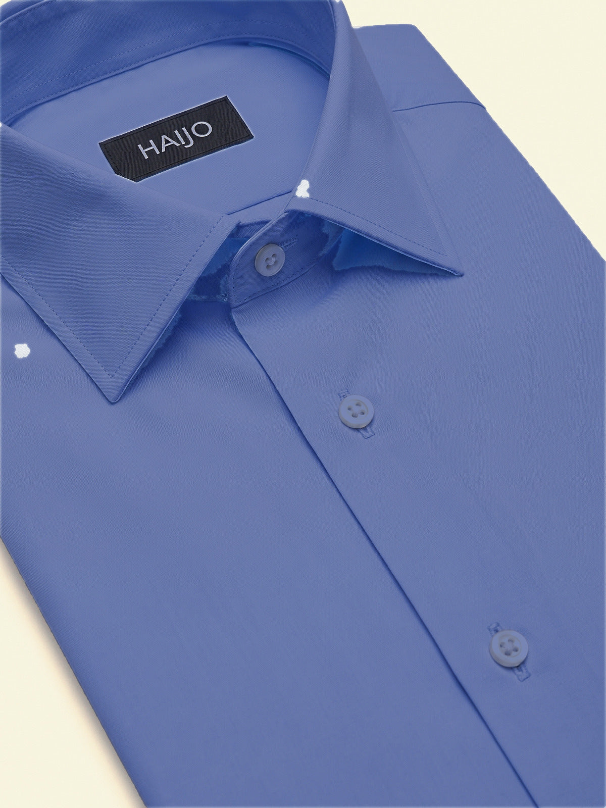 Classic Shirt, Light Blue Slim, folded, showing the collar and the Hajjo label