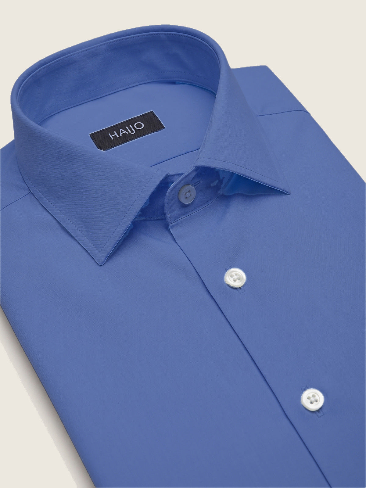 Classic Shirt, Light Blue Slim, folded, showing the collar and the Hajjo label