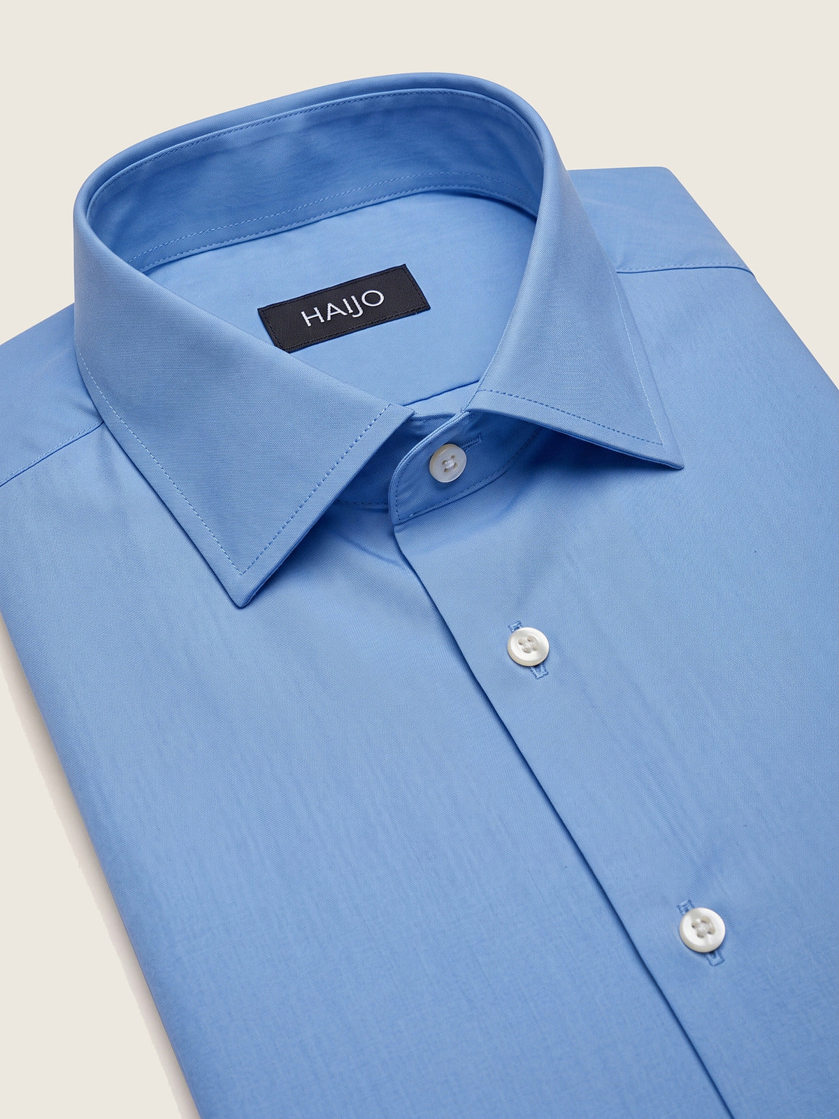 Classic Shirt, Mid Blue, folded, showing the collar and the Hajjo label