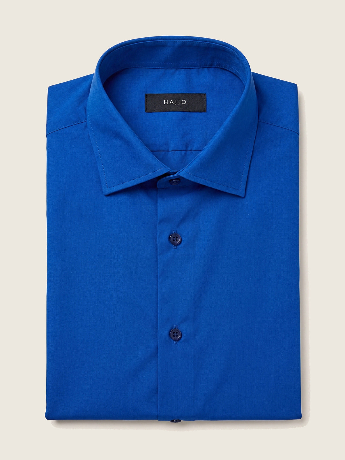 Classic Shirt, Navy Comfort, folded, showing the collar and the Hajjo label