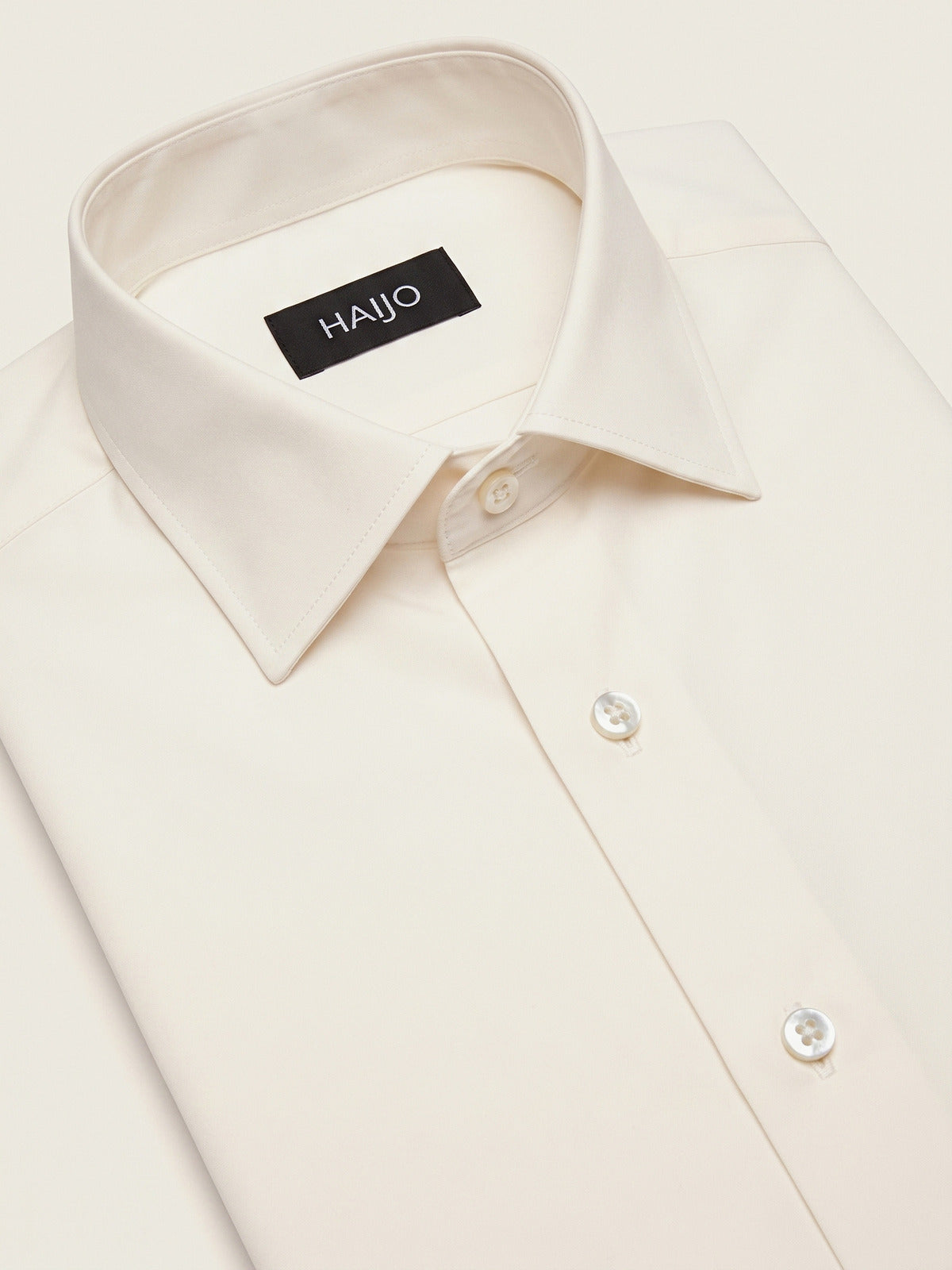 Classic Shirt, Off White Comfort, folded, showing the collar and the Hajjo label