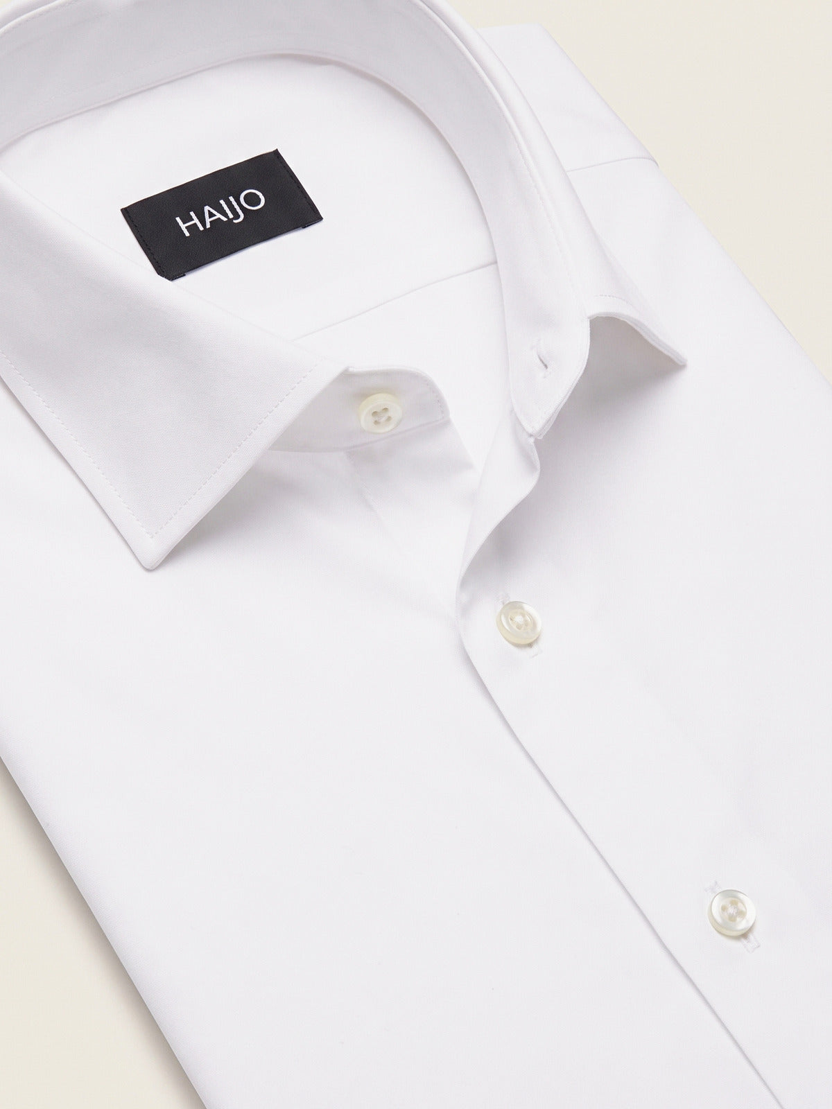 Classic Shirt, White Comfort, folded, showing the collar and the Hajjo label