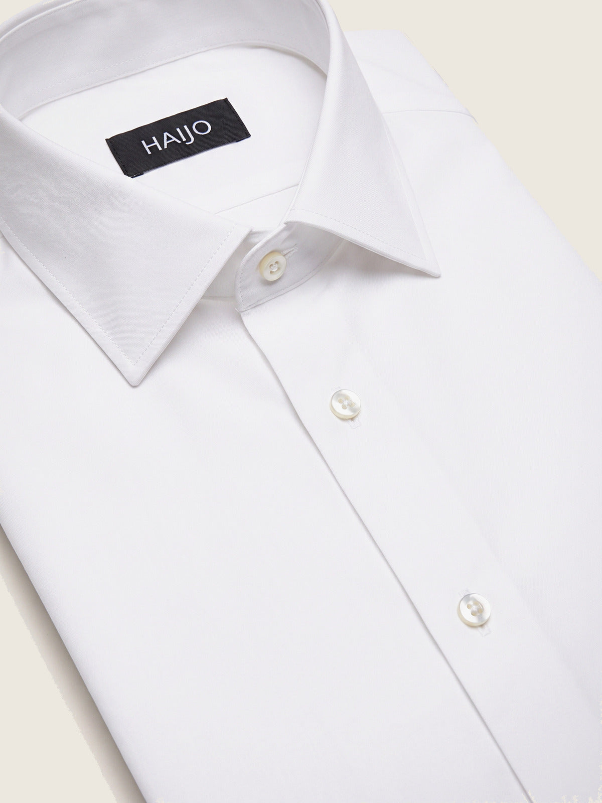 Classic Shirt, White Slim, folded, showing the collar and the Hajjo label