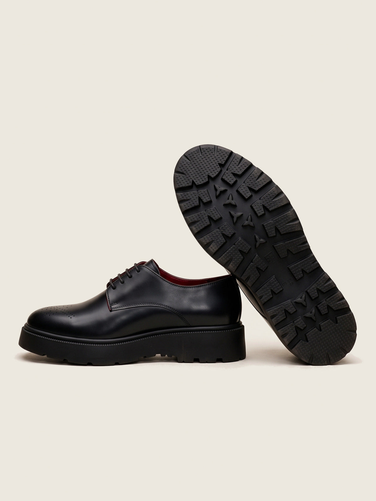 Derby, Black, the pair, one shoe showing the sole