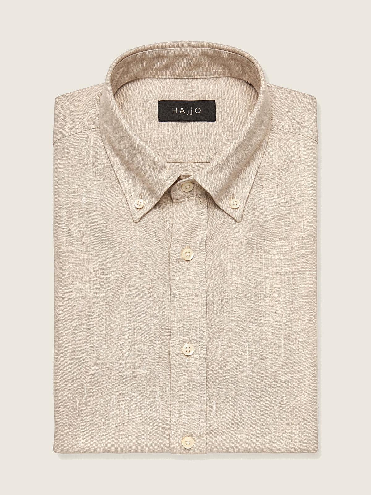 Linen Shirt, Beige, folded, showing the collar and the Hajjo label