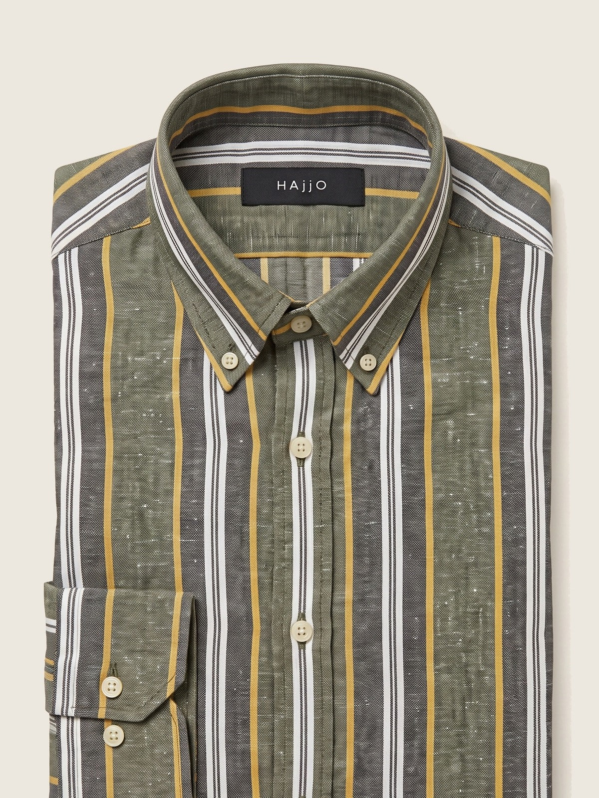 Linen Shirt, Olive and Mid Grey, folded, showing the collar and the Hajjo label