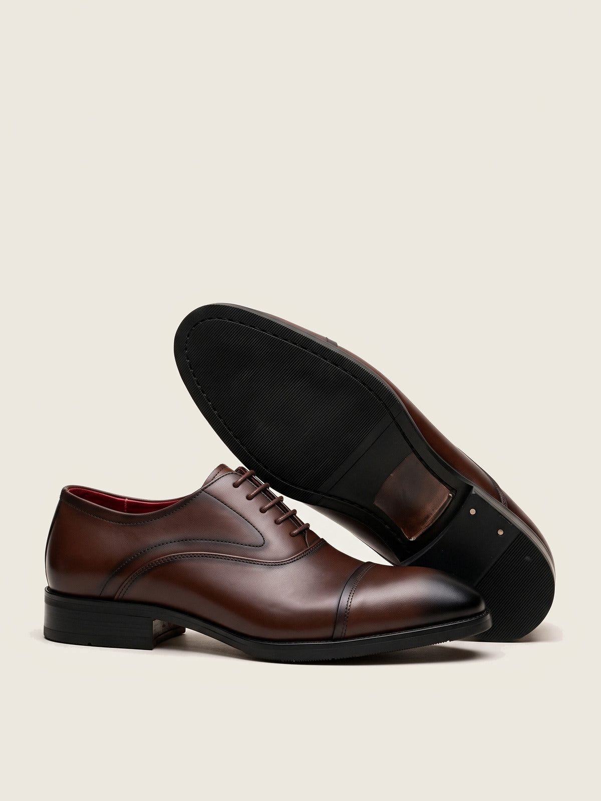 Oxford, Brown, the pair, one shoe showing the sole