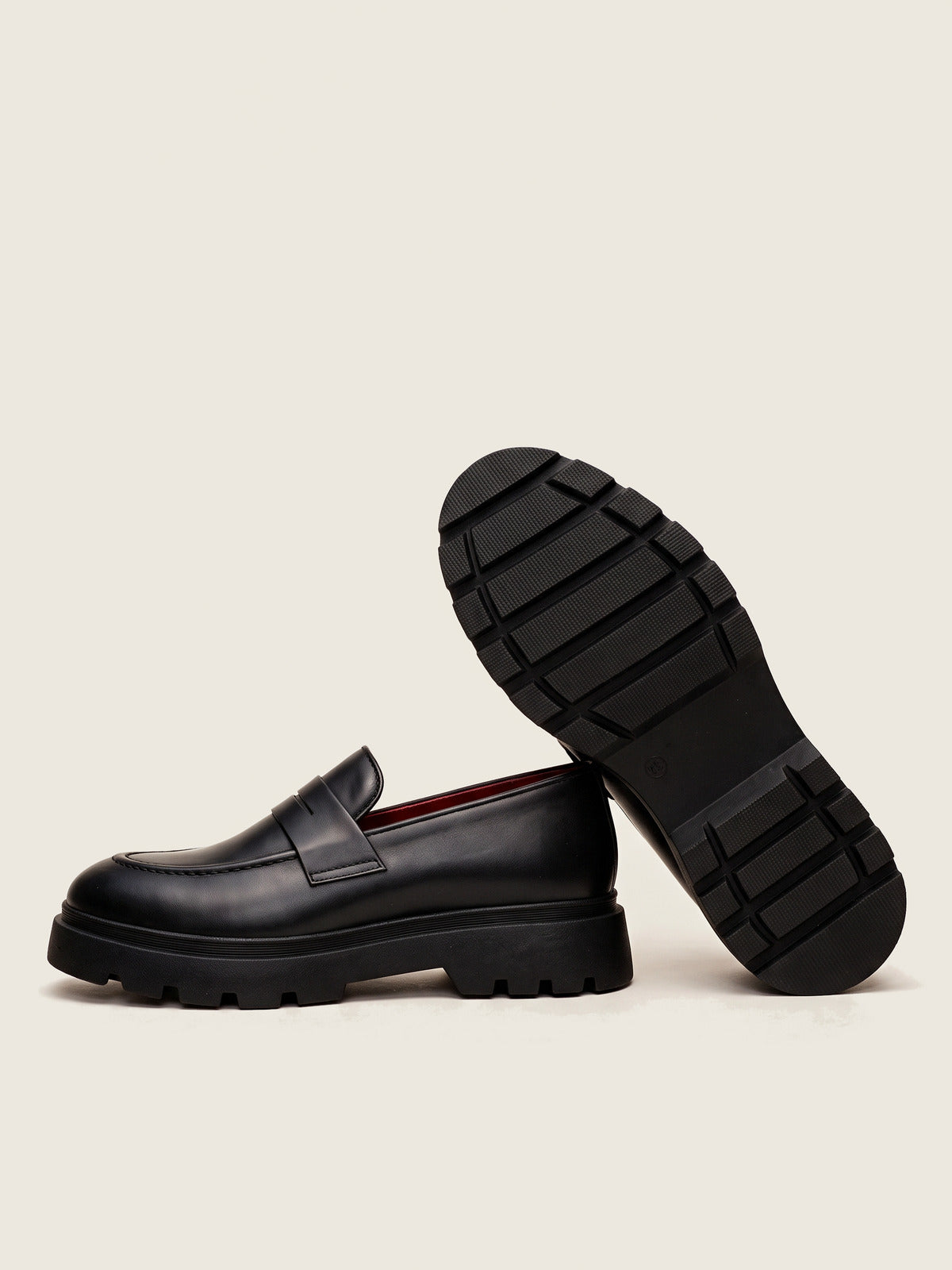 Penny Loafer, Black, the pair, one shoe showing the sole