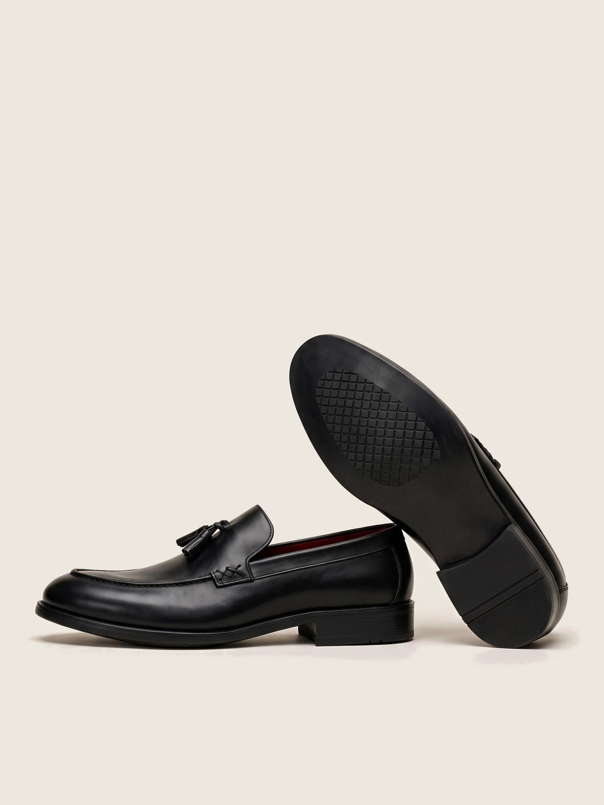 Tassel Loafer, Black, the pair, one shoe showing the sole